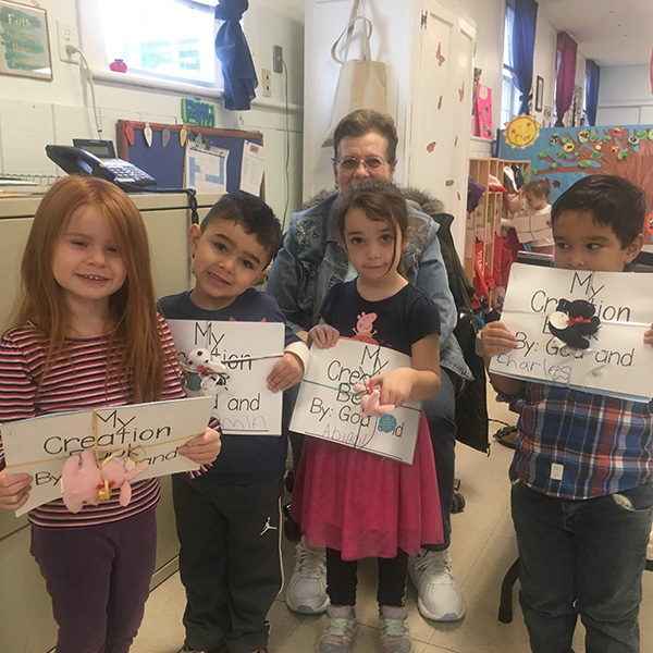 4 Year Old Program students holding books